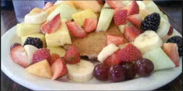 Stack of Fresh Fruit on Pancakes